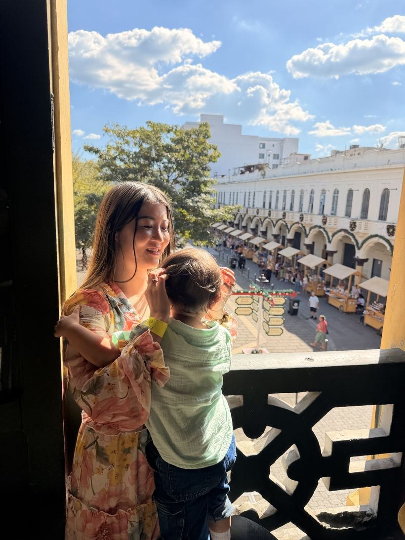 Emmy with her son by the window